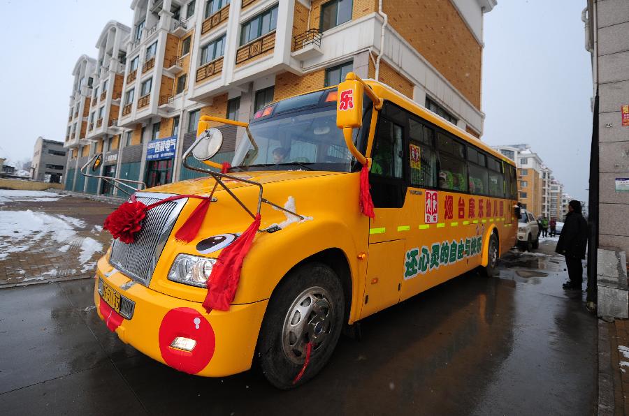 Photo taken on Dec. 10, 2011 shows an American-style school bus of a kindergarten in Fushan District, Yantai City, east China&apos;s Shandong Province. 