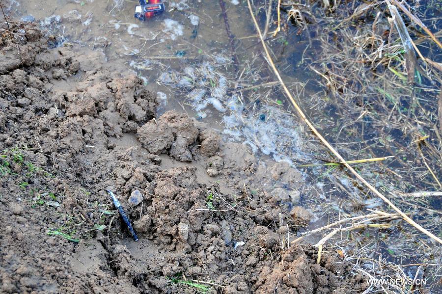 Photo taken on Dec. 13, 2011 shows the accident site of a school bus crash in Fengxian county of Xuzhou city, east China&apos;s Jiangsu Province. 