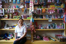 Long Xiuping owns the biggest shop selling school materials in Shahe Town. It's also children's favorite place. Long once worked in factories and ran small businesses in Zhejiang, Hebei and Guangdong provinces. Last year, she decided to return home and start her own business.