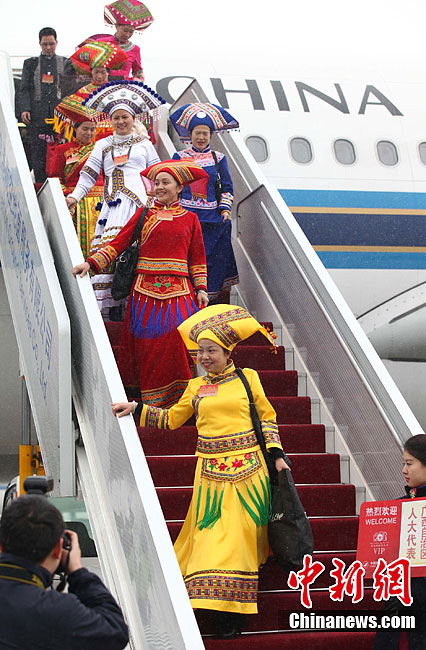 NPC deputies from Guangxi Zhuang Autonomous Region arrive in Beijing to attend the NPC and CPPCC annual sessions, March 2, 2012.