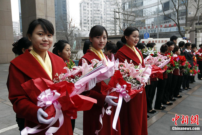 Receptionists are ready for the upcoming China's National People's Congress (NPC) and CPPCC sessions. 