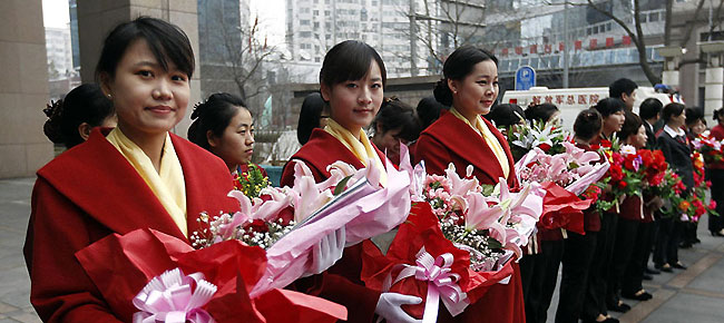 Receptionists are ready for the upcoming China's National People's Congress (NPC) and CPPCC sessions.