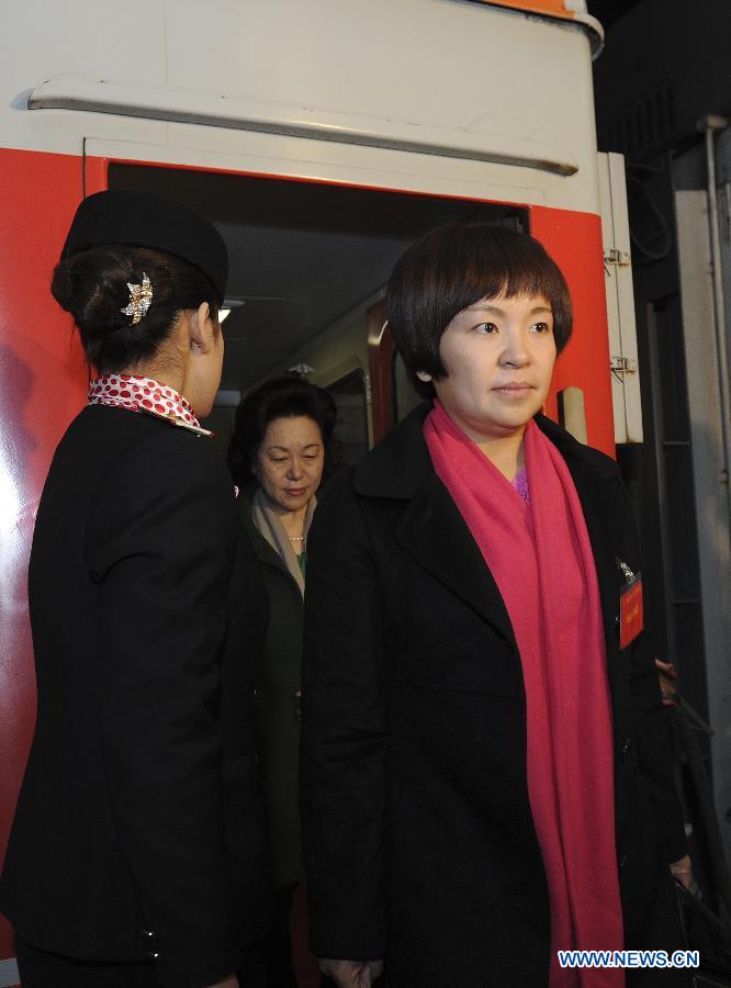 Deputies to the Fifth Session of the 11th National People's Congress (NPC) from central China's Henan Province arrive in Beijing, capital of China, March 2, 2012. 