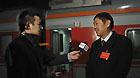 Liu Guoqing (R), a deputy to the Fifth Session of the 11th National People's Congress (NPC) from central China's Henan Province, speaks to journalists as he arrives in Beijing, capital of China, March 2, 2012.