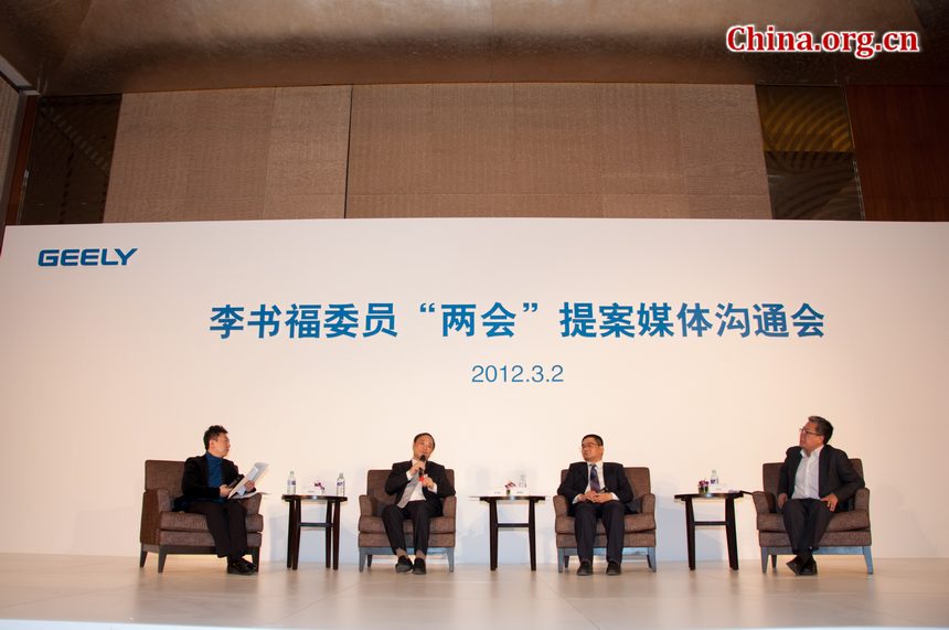 Li Shufu (L2), chairman and chief executive of Geely Automobile Holding Company Ltd., and also member of Chinese People&apos;s Political Consultative Conference (CPPCC) meets the press on Friday, March 2, 2012, one day before the CPPCC formally starts on Saturday.