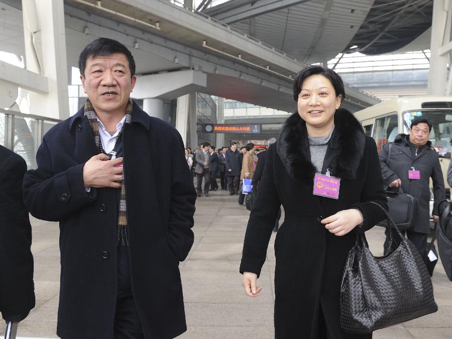 Deputies to the Fifth Session of the 11th National People's Congress (NPC) from east China's Shanghai arrive in Beijing, capital of China, March 2, 2012. The Fifth Session of the 11th NPC is scheduled to open in Beijing on March 5. 