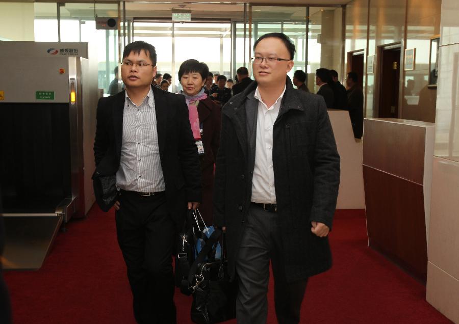 Members of the 11th National Committee of the Chinese People's Political Consultative Conference (CPPCC) from south China's Macao Special Administrative Region arrive in Beijing, capital of China, March 2, 2012. 