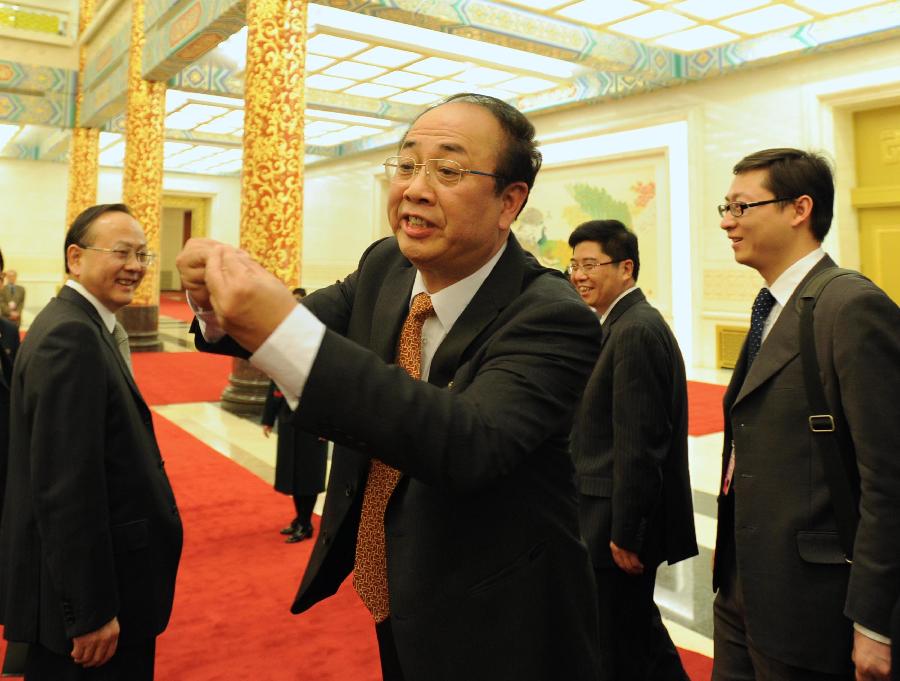 Zhao Qizheng (C), spokesman of the Fifth Session of the 11th Chinese People's Political Consultative Conference (CPPCC) National Committee, responds to journalists after a news conference on the CPPCC session at the Great Hall of the People in Beijing, capital of China, March 2, 2012. The Fifth Session of the 11th CPPCC National Committee is scheduled to open in Beijing on March 3. 