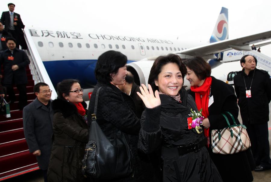 Deputies to the Fifth Session of the 11th National People's Congress (NPC) from southwest China's Chongqing Municipality arrive in Beijing, capital of China, March 2, 2012. 