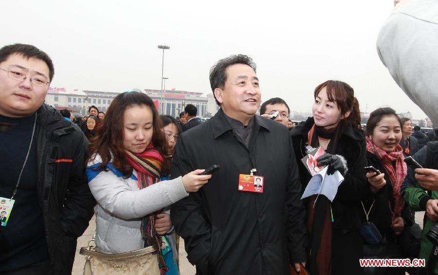 Jiang Kun, a member of the 11th National Committee of the Chinese People's Political Consultative Conference (CPPCC), speaks to journalists prior to the CPPCC session outside the Great Hall of the People in Beijing, capital of China, March 3, 2012. 