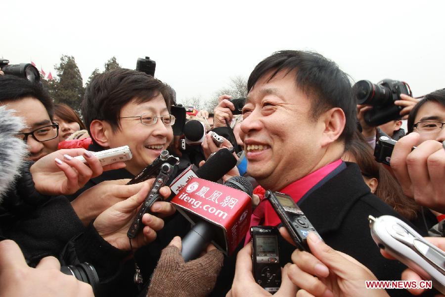 Wang Chaobin, a member of the 11th National Committee of the Chinese People's Political Consultative Conference (CPPCC), speaks to journalists prior to the CPPCC session outside the Great Hall of the People in Beijing, capital of China, March 3, 2012. 