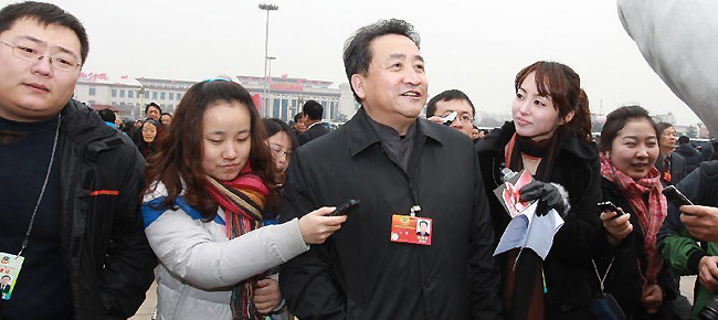 Jiang Kun, a member of the 11th National Committee of the Chinese People's Political Consultative Conference (CPPCC), speaks to journalists prior to the CPPCC session outside the Great Hall of the People in Beijing, capital of China, March 3, 2012.