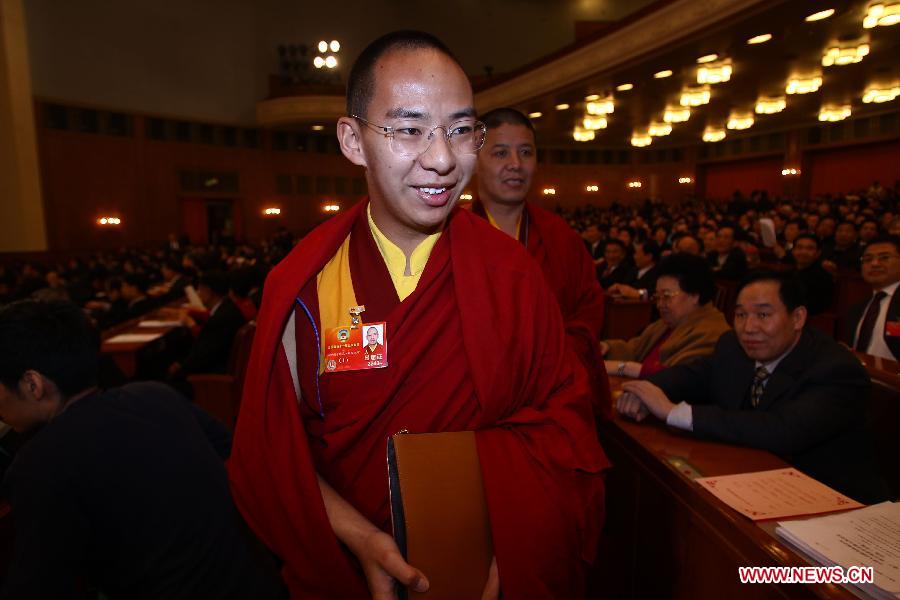 The 11th Panchen Lama Bainqen Erdini Qoigyijabu, a member of the 11th National Committee of the Chinese People's Political Consultative Conference (CPPCC), prepares to attend the Fifth Session of the 11th CPPCC National Committee at the Great Hall of the People in Beijing, capital of China, March 3, 2012. 