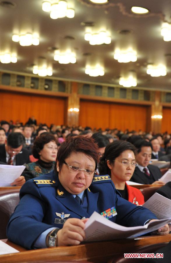 Han Hong (front), a member of the 11th National Committee of the Chinese People's Political Consultative Conference (CPPCC), attends the Fifth Session of the 11th CPPCC National Committee at the Great Hall of the People in Beijing, capital of China, March 3, 2012. 
