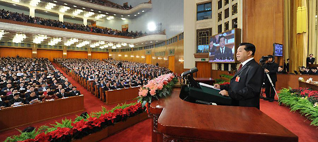 Jia Qinglin (R), chairman of the National Committee of the Chinese People's Political Consultative Conference (CPPCC), delivers a report at the Great Hall of the People in Beijing, capital of China, March 3, 2012.