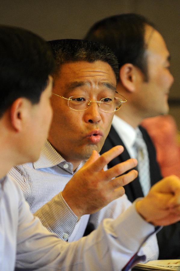 Yang Keng, a member of the 11th National Committee of the Chinese People's Political Consultative Conference (CPPCC), speaks during a panel discussion of the Fifth Session of the 11th CPPCC National Committee in Beijing, capital of China, March 4, 2012. 