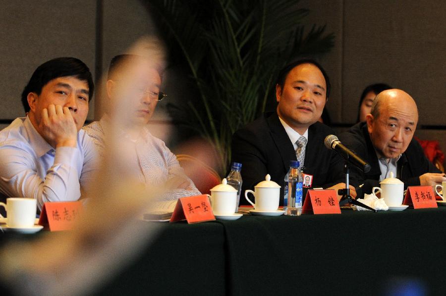 Members of the 11th National Committee of the Chinese People's Political Consultative Conference (CPPCC) join in a panel discussion of the Fifth Session of the 11th CPPCC National Committee in Beijing, capital of China, March 4, 2012. 