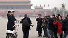 Two police officers riding two-wheeled patrol scooters became the focus of the media after the opening ceremony of the fifth session of the 11th CPPCC National Committee in Beijing, March 3, 2012.
