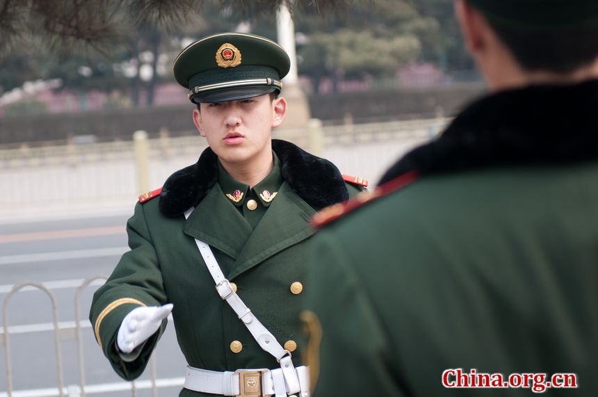 Two armed police soldiers patrol the east perimeter of the Great Hall of the People in Beijing, China on Sunday, March 4, 2012, one day before the annual session of China&apos;s National People&apos;s Congress, the country&apos;s national legislature opens on Monday. [China.org.cn]