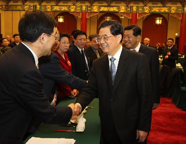 Chinese President Hu Jintao (R, front), who is also General Secretary of the Central Committee of the Communist Party of China (CPC) and Chairman of the Central Military Commission, visits and joins a panel discussion of members of the 11th National Committee of the Chinese People's Political Consultative Conference (CPPCC) from the health sector and social welfare and security sectors in Beijing, capital of China, March 4, 2012.