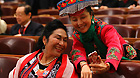 Two members of the Chinese People's Political Consultative Conference National Committee capture the memeries with a mobile phone at the opening ceremony of this year's session in Beijing, March 3, 2012.