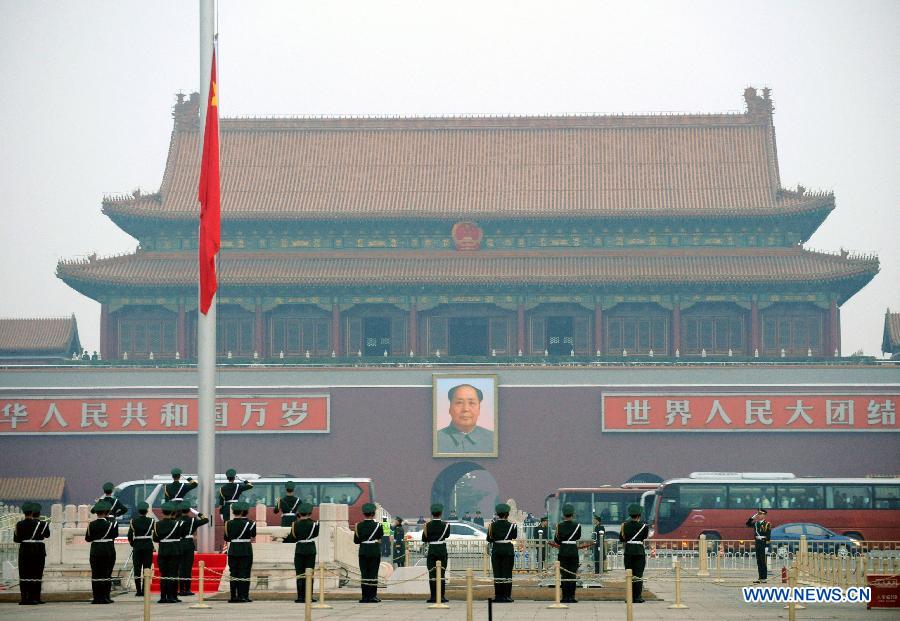 A flag-raising ceremony is held on the Tiananmen Square near the Great Hall of the People in Beijing, capital of China, March 5, 2012. The Fifth Session of the 11th National People's Congress (NPC) will open in Beijing on Monday. 