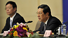 Zhang Ping (R), minister of the National Development and Reform Commission, speaks at a press conference of the Fifth Session of the 11th National People's Congress (NPC) in Beijing, capital of China, March 5, 2012.