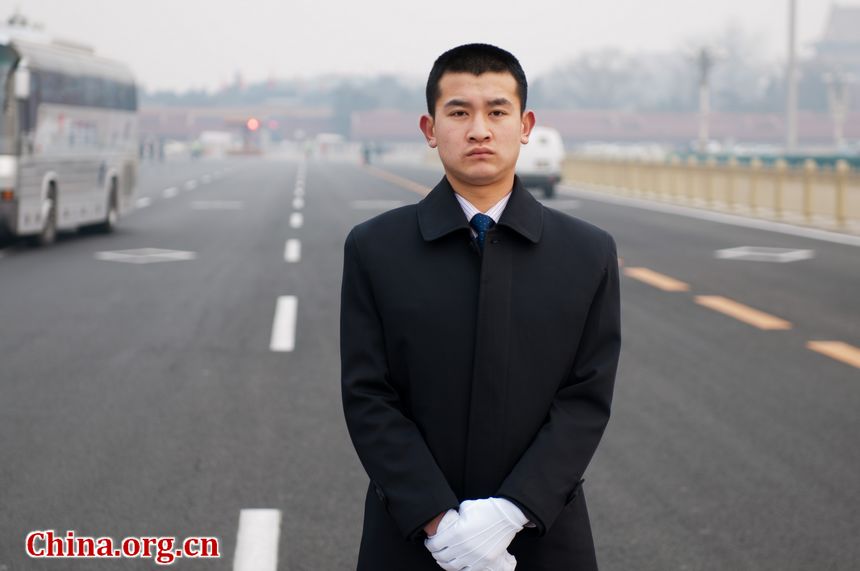 Staff members with China&apos;s secret service ready for duty at the Tian&apos;anmen Square near the Great Hall of the People, the venue of China&apos;s National People&apos;s Congress. [China.org.cn]