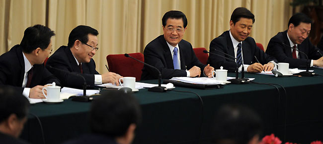 Chinese President Hu Jintao (3rd R), who is also General Secretary of the Central Committee of the Communist Party of China (CPC) and Chairman of the Central Military Commission, visits deputies to the Fifth Session of the 11th National People's Congress (NPC) from east China's Jiangsu Province and joins their panel discussion in Beijing, capital of China, March 5, 2012.