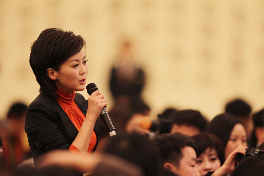 A journalist raises questions during a press conference of Chinese Foreign Minister Yang Jiechi held on the sidelines of the Fifth Session of the 11th National People&apos;s Congress (NPC) at the Great Hall of the People in Beijing, China, March 6, 2012.
