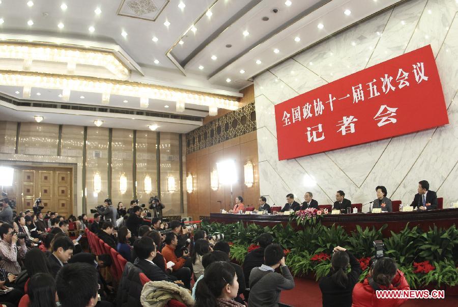 Members of the 11th National Committee of the Chinese People's Political Consultative Conference (CPPCC) Li Yining, Xu Shanda, Chen Xiwen, Ma Xiuhong, Yang Kaisheng and Ren Hongbin attend a press conference in Beijing, capital of China, March 6, 2012. 