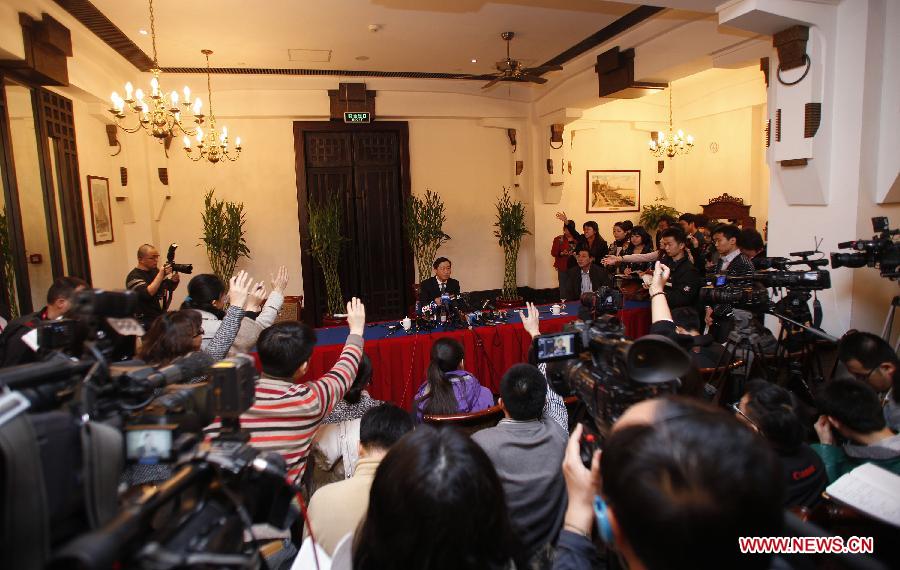 Li Daokui, a member of the 11th National Committee of the Chinese People's Political Consultative Conference (CPPCC) and advisor of the Monetary Policy Committee of the People's Bank of China, reacts during a press conference in Beijing, capital of China, March 6, 2012. Li held a press conference on some hot economic issues on the sidelines of the Fifth Session of the 11th National Committee of the CPPCC in Beijing on Tuesday.