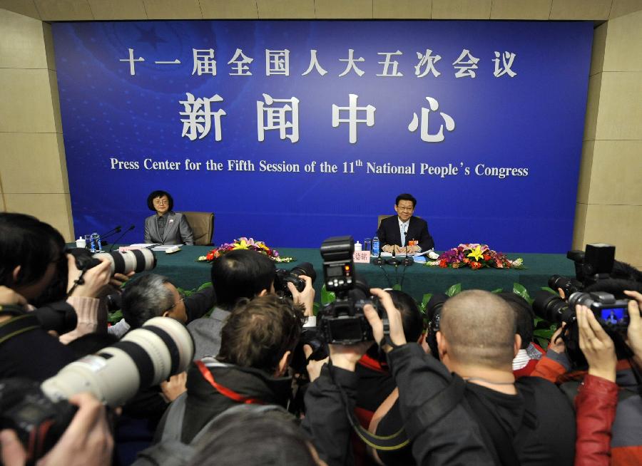 Chinese Commerce Minister Chen Deming reacts during a news conference of the Fifth Session of the 11th National People&apos;s Congress (NPC) in Beijing, China, March 7, 2012.