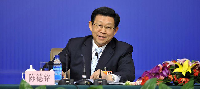 Chinese Commerce Minister Chen Deming reacts during a news conference of the Fifth Session of the 11th National People's Congress (NPC) in Beijing, China, March 7, 2012.