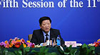 Yin Weimin, minister of human resources and social security, gives a press conference on China's employment situation and social security in Beijing, March 7, 2012.