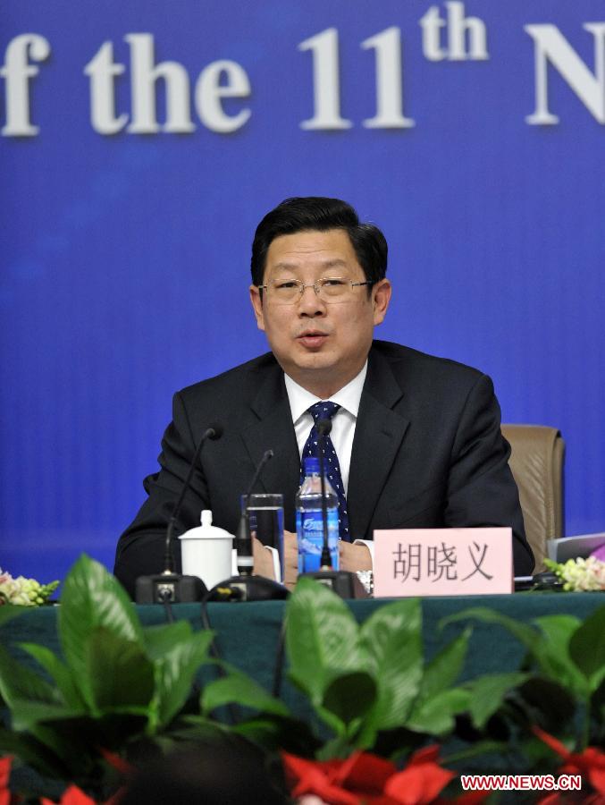 Vice minister of Human Resources and Social Security Hu Xiaoyi answers questions of journalists during a news conference of the Fifth Session of the 11th National People's Congress (NPC) in Beijing, China, March 7, 2012. 