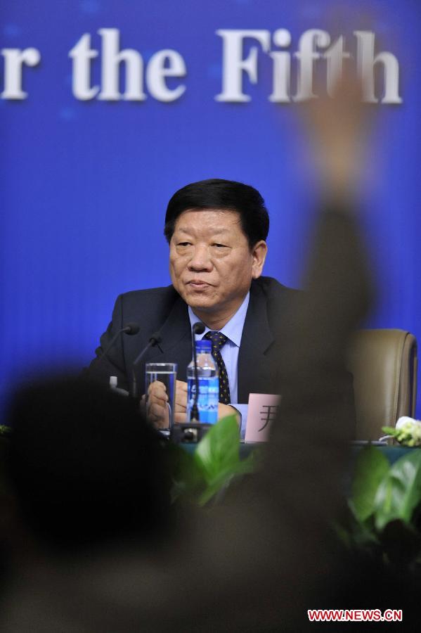 Minister of Human Resources and Social Security Yin Weimin reacts during a news conference of the Fifth Session of the 11th National People's Congress (NPC) in Beijing, China, March 7, 2012.