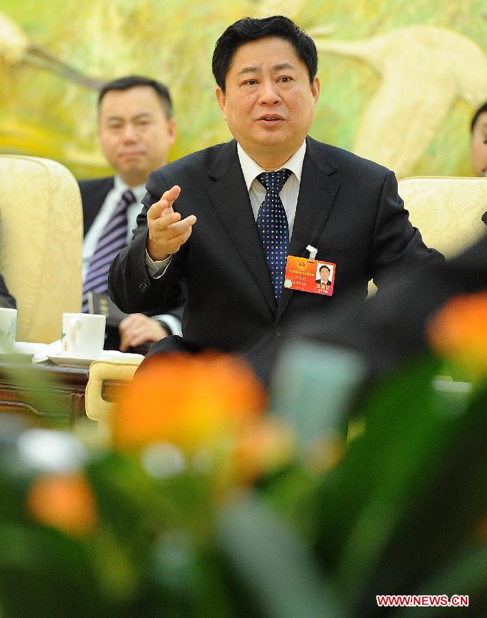 He Daxin, a deputy to the Fifth Session of the 11th National People's Congress (NPC), speaks during a panel discussion of southeast China's Taiwan delegation at the Great Hall of the People in Beijing, capital of China, March 7, 2012.