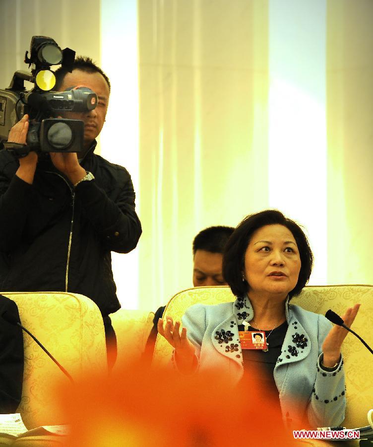 Chen Yunying, a deputy to the Fifth Session of the 11th National People's Congress (NPC), speaks during a panel discussion of southeast China's Taiwan delegation at the Great Hall of the People in Beijing, capital of China, March 7, 2012. 