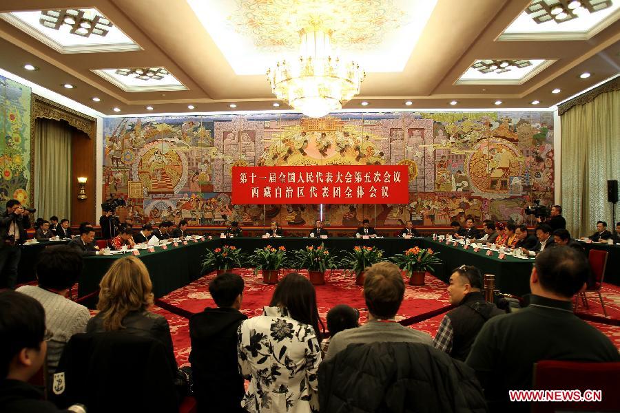 Deputies to the Fifth Session of the 11th National People's Congress (NPC) from southwest China's Tibet Autonomous Region take part in a panel discussion in Beijing, capital of China, March 7, 2012. 