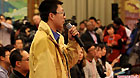 A journalists raises questions at a panel discussion of deputies to the Fifth Session of the 11th National People's Congress (NPC) from southwest China's Tibet Autonomous Region in Beijing, capital of China, March 7, 2012.