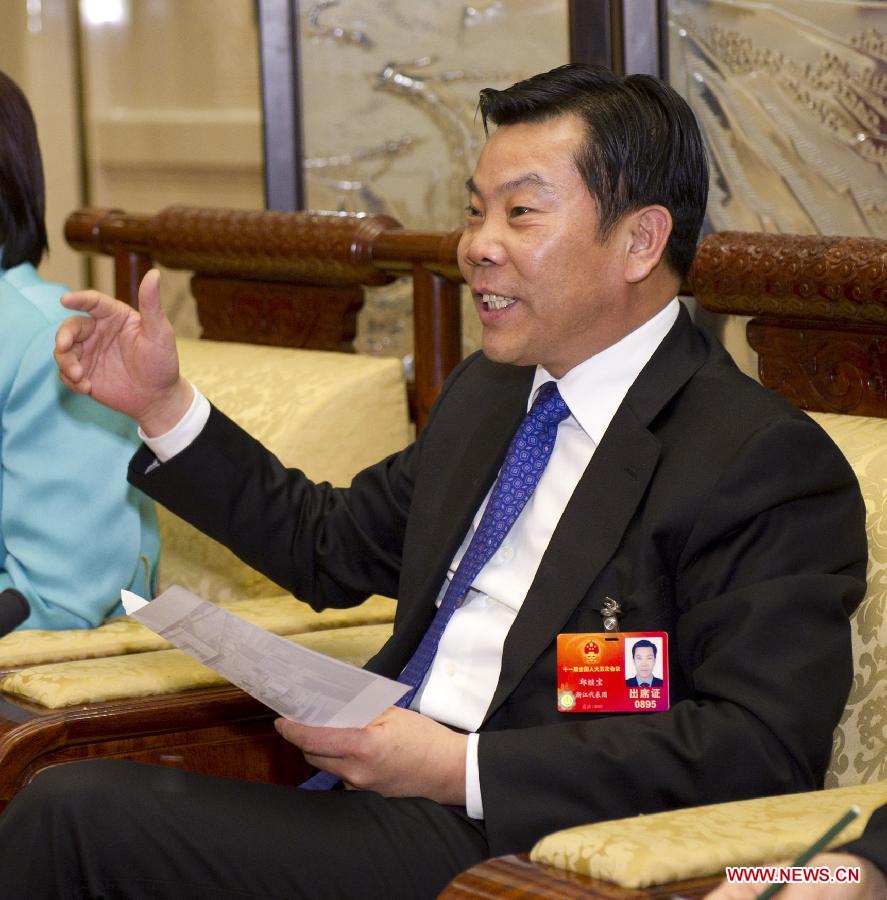 Qiu Jibao, a deputy to the Fifth Session of the 11th National People's Congress (NPC) from east China's Zhejiang Province, speaks during a panel discussion on supporting the development of small and micro businesses in Beijing, capital of China, March 7, 2012.