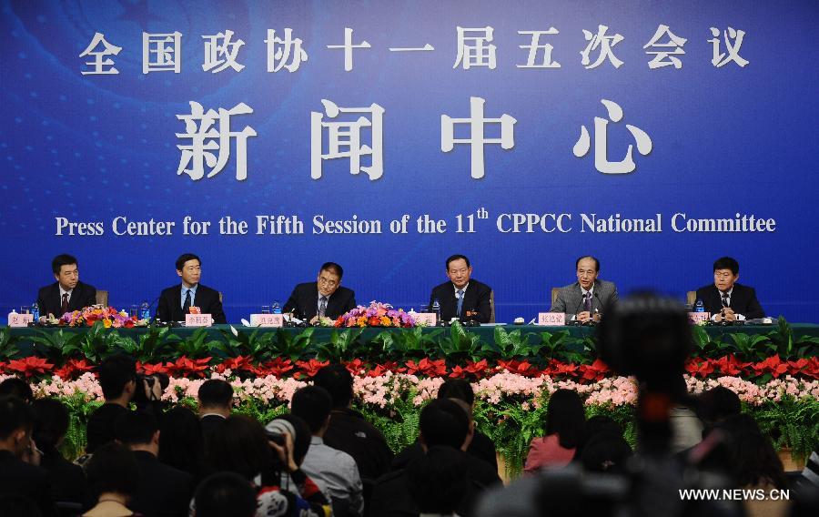 Members of the 11th National Committee of the Chinese People's Political Consultative Conference (CPPCC) Liu Kegu, Yang Chao, Zhang Hongming, Li Daokui and Tian Zaiwei attend a news conference of the Fifth Session of the 11th CPPCC National Committee on the construction and management of housing for low-income residents in Beijing, capital of China, March 7, 2012.