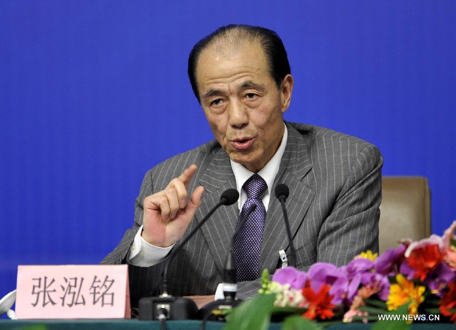 Zhang Hongming, a member of the 11th National Committee of the Chinese People's Political Consultative Conference (CPPCC), speaks during a news conference of the Fifth Session of the 11th CPPCC National Committee on the construction and management of housing for low-income residents in Beijing, capital of China, March 7, 2012.