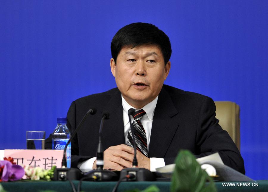 Tian Zaiwei, a member of the 11th National Committee of the Chinese People's Political Consultative Conference (CPPCC), speaks during a news conference of the Fifth Session of the 11th CPPCC National Committee on the construction and management of housing for low-income residents in Beijing, capital of China, March 7, 2012.