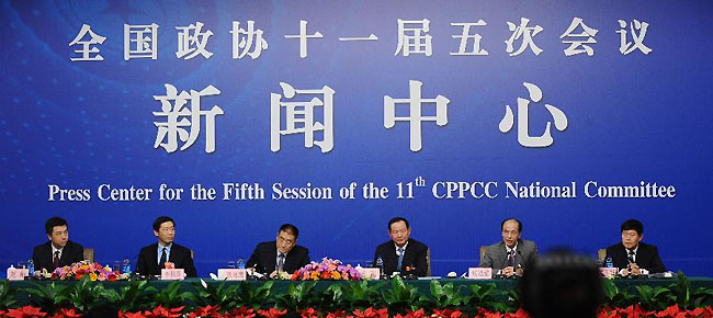 Members of the 11th National Committee of the Chinese People's Political Consultative Conference (CPPCC) Liu Kegu, Yang Chao, Zhang Hongming, Li Daokui and Tian Zaiwei attend a news conference of the Fifth Session of the 11th CPPCC National Committee on the construction and management of housing for low-income residents in Beijing, capital of China, March 7, 2012.