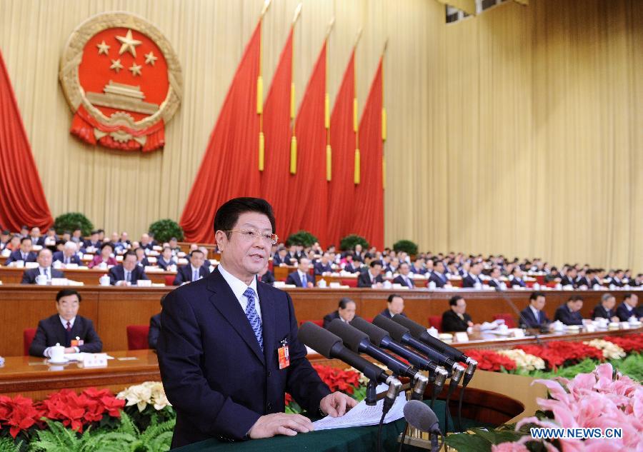 Wang Zhaoguo, vice chairman of the Standing Committee of the National People's Congress (NPC), gives explanations of the draft amendment to the Criminal Procedural Law during the second plenary meeting of the Fifth Session of the 11th NPC at the Great Hall of the People in Beijing, capital of China, March 8, 2012.