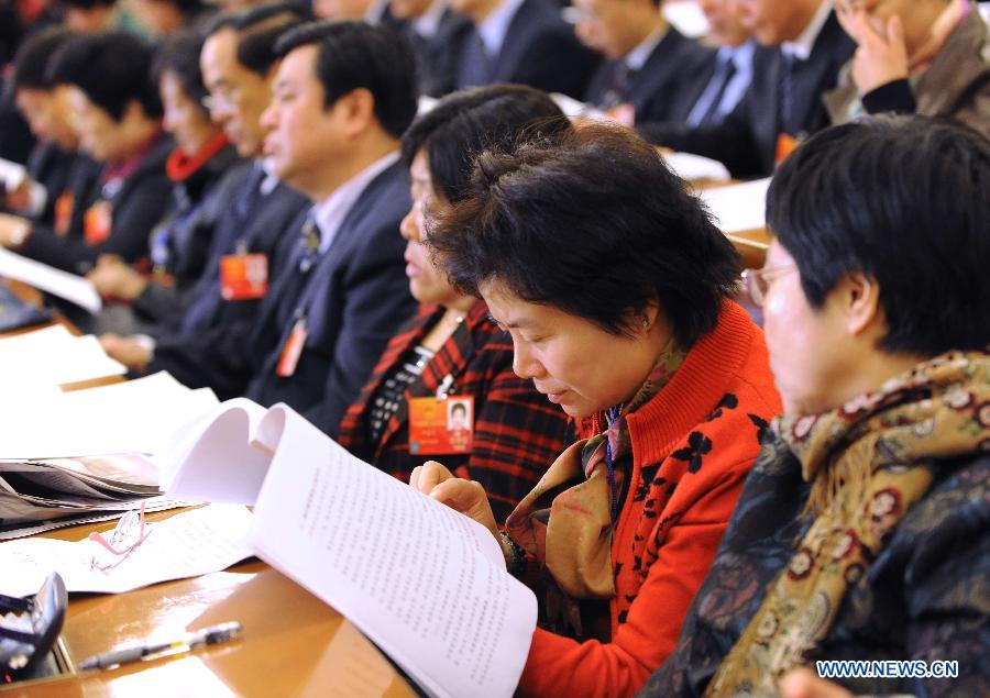 Deputies attend the second plenary meeting of the Fifth Session of the 11th National People's Congress (NPC) at the Great Hall of the People in Beijing, capital of China, March 8, 2012.