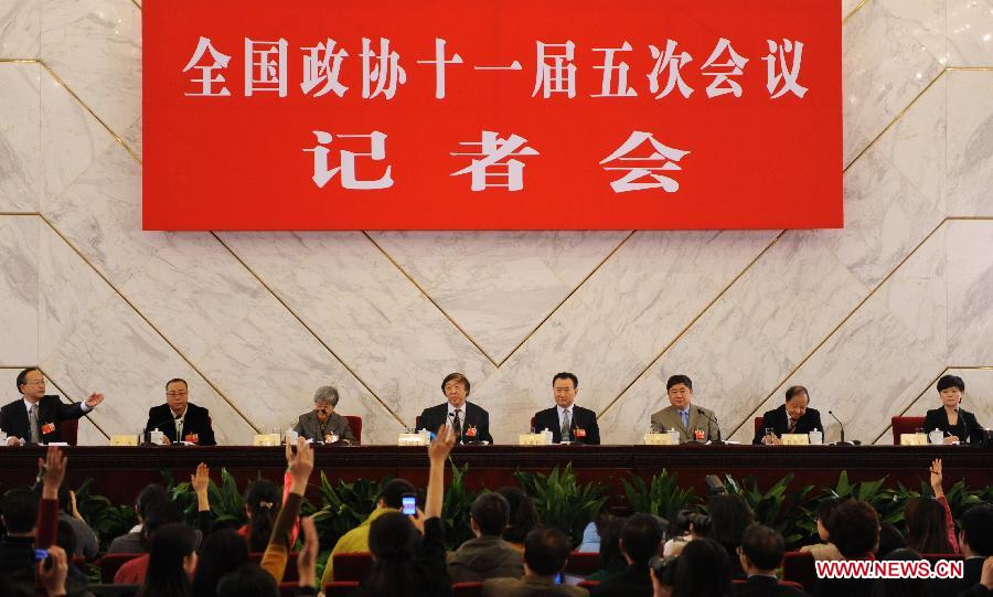 Members of the 11th National Committee of the Chinese People's Political Consultative Conference (CPPCC) Feng Jicai (4th L), Wang Jianlin (4th R), Shan Jixiang (3rd R), Yin Li (2nd L), Fan Jinshi (3rd L) and Zhang Heping (2nd R) attend a news conference of the Fifth Session of the 11th CPPCC National Committee on the reform of cultural system in Beijing, capital of China, March 8, 2012. 