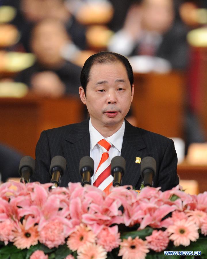 Hu Chengzhong, a member of the 11th National Committee of the Chinese People's Political Consultative Conference (CPPCC), speaks during the second plenary meeting of the Fifth Session of the 11th CPPCC National Committee at the Great Hall of the People in Beijing, capital of China, March 9, 2012.